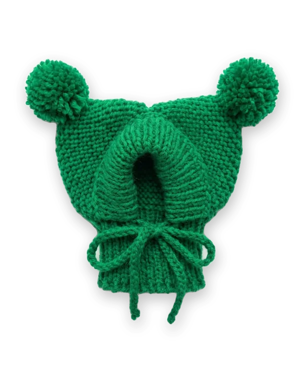 Green knitted dog hood with two pom-poms