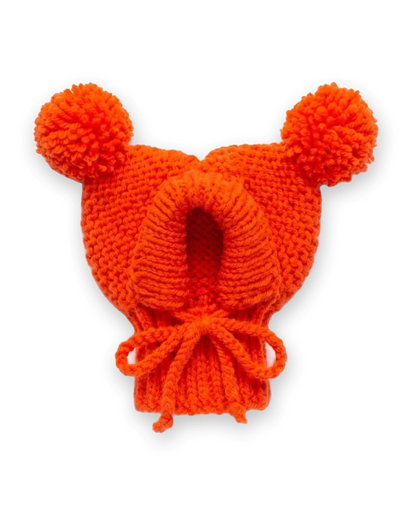 Orange knitted dog hood with two pom-poms
